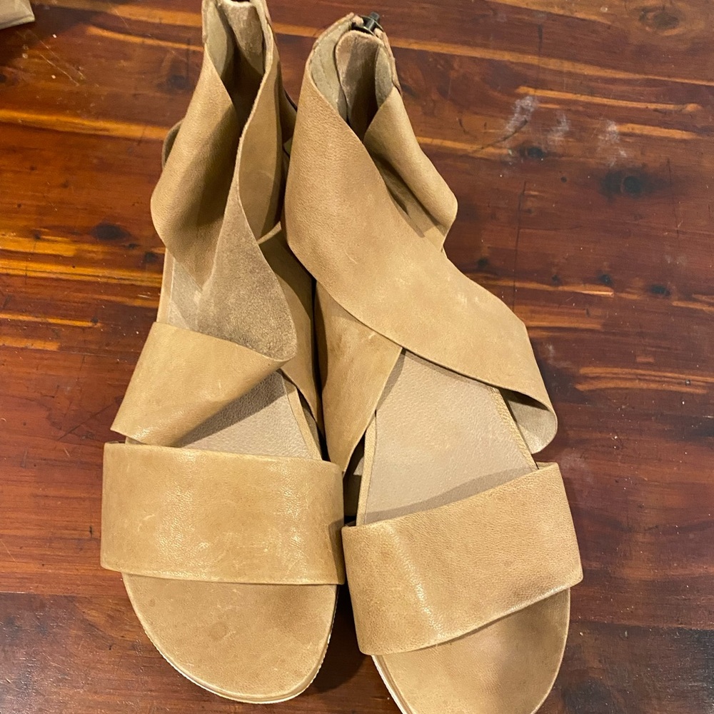 Strappy sandals with zip at heel. Only worn once literally.